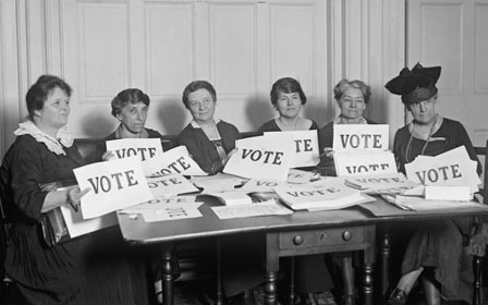 Women with Vote signs