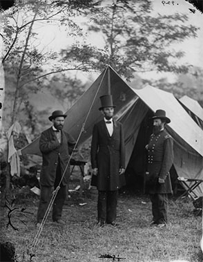 Abe Lincoln in front of tent